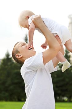 Happy Kid and Little Baby outdoor