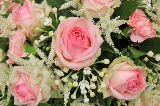 Pink roses and white staphanotis in a bridal bouquet