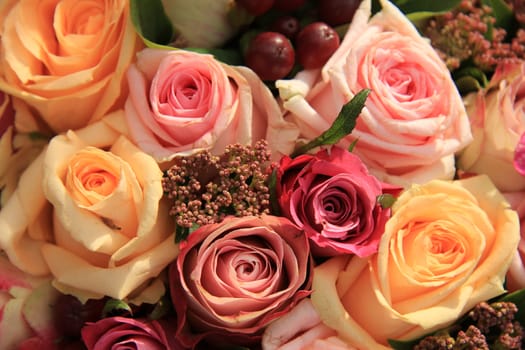 Pastel roses in different shades of pink in a bridal arrangement