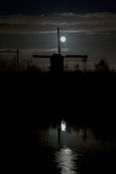 windmill on the background light of the moon