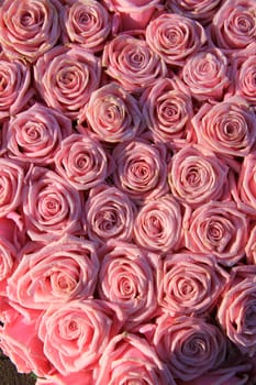 Pink roses in a floral wedding arrangement