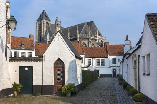 Kortrijk Beguinage and the Notre Dame Church nearby, Flanders, Belgium.