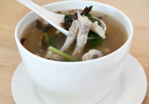 Chicken feet in a bowl with spicy soup,thai food 