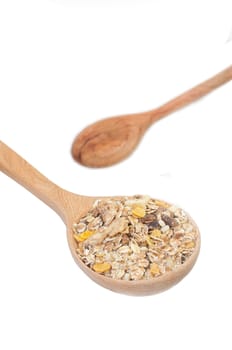 the closed up spoon of muesli with isolated background