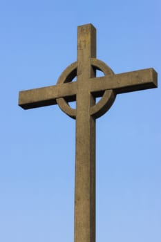 Irish cross against blue sky used as memorial for fishermen lost at sea in Zeebrugge-Seabruges, Belgium.