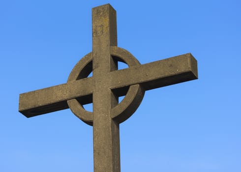 Top of Irish cross against blue sky used as memorial for fishermen lost at sea in Zeebrugge-Seabruges, Belgium.