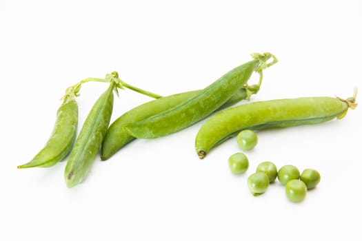 Fresh green peas on white background