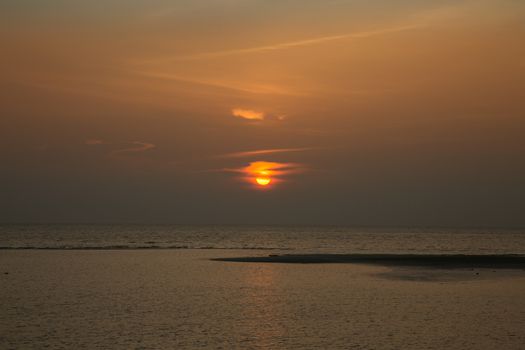 Beautiful tropical sunset over the sea, low tide 