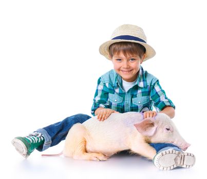 Little farmer. Cute boy with pig. Isolated on white background.