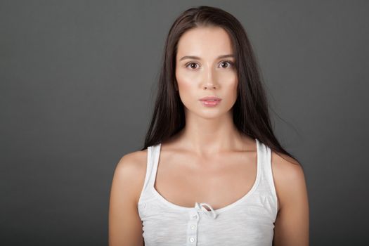 Portrait of a woman on gray background