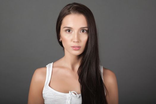 Portrait of a woman on gray background