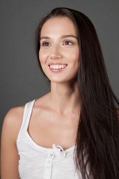 Portrait of a woman on gray background