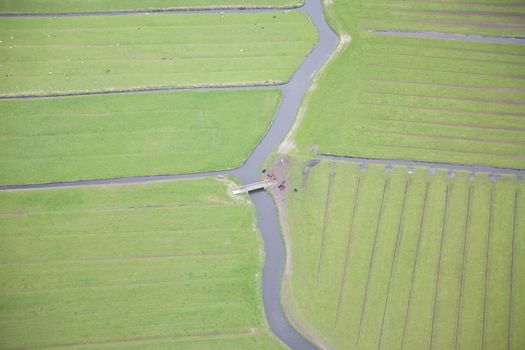 Green landscape with water and bridge from above, The Netherlands