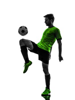 one soccer football player young man juggling in silhouette studio on white background