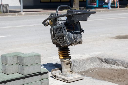 Trench Rammer on the street during the road repair