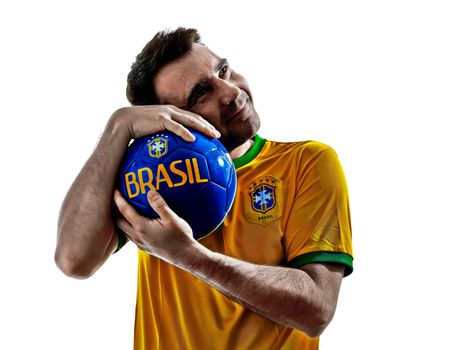 one man with Brazilian jersey hugging soccer ball isolated in white background