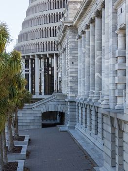 New Zealand Parliament government building known as Beehive in Wellington with Parliament House in foreground