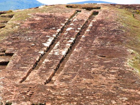 Two channels on the rock in archeological site El fuerte of Samaipata (Bolivia)