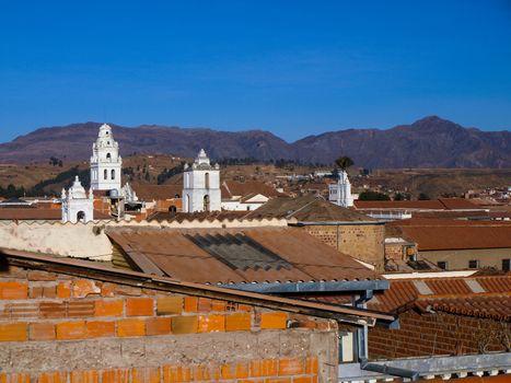 White colonial towers and orange rooftops in Sucre (Bolivia)