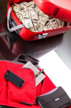 A Suitcase with lots of dollars, ready for business
