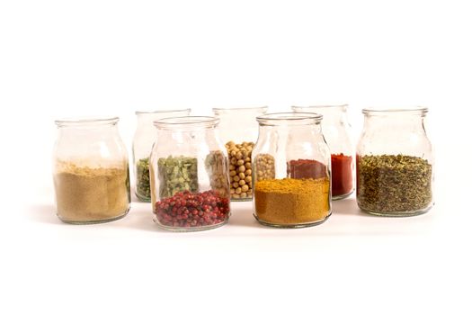 Variety of spices in a glass pot.