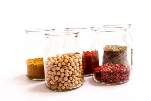 Variety of spices in a glass pot.
