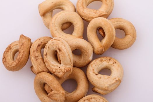 Lots of Tarallis on a white background 
