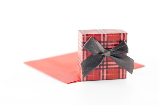 red enveloper and scotch gift box isolated on white background