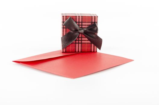 red enveloper and scotch gift box isolated on white background