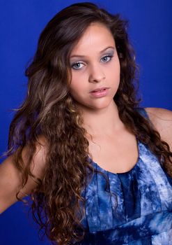 young beautiful woman, on a blue background