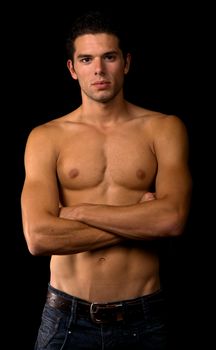 young sensual man on a black background