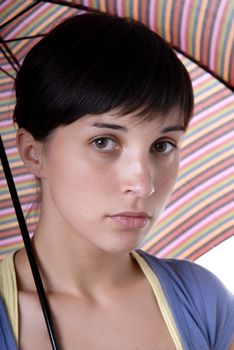 young brunette girl with umbrella in colors