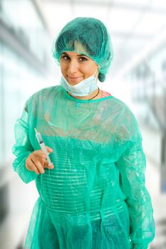 young woman nurse portrait with a syringe