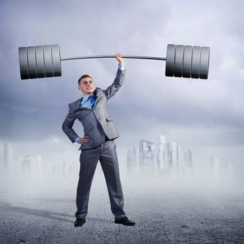 businessman holding a barbell with one hand, the concept of achievements in business