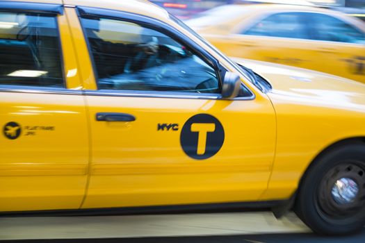 NEW YORK, US - NOVEMBER 21: Motion blurred shot of famous New York yellow taxi. November 21, 2013 in New York.