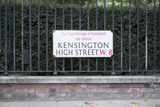 LONDON, UK - OCTOBER 04: High Street Kensington street sign outside Kensington Gardens. October 04, 2013 in London.