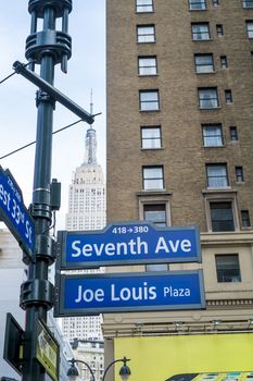 NEW YORK, US - NOVEMBER 23: Seventh Avenue and Joe Louis Plaza street signs. November 23, 2013 in New York.