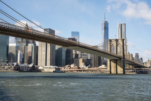 NEW YORK, US - NOVEMBER 24: Lower Manhattan skyline crossed by Brooklyn Bridge. November 24, 2013 in New York.