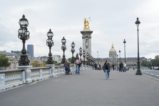 PARIS, FRANCE - OCTOBER 20: Pont des Invalides with Hopital des Invalides in the far background. October 20, 2013 in Paris.