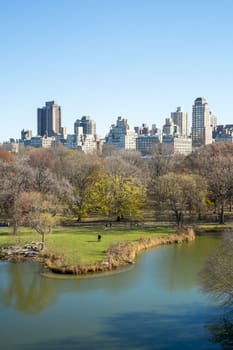 NEW YORK, US - NOVEMBER 23: Manhattan skyline with Central Park lake in the foreground in Autumn. November 23, 2013 in New York.