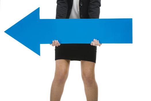 Beautiful young business woman holding a blue arrow, over a white background