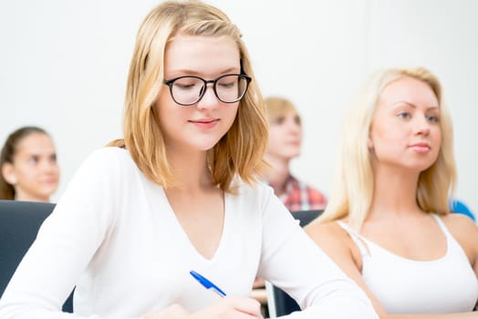 image of a young female students in the classroom, teaching at the University of