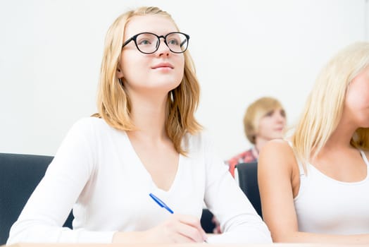 image of a young female students in the classroom, teaching at the University of