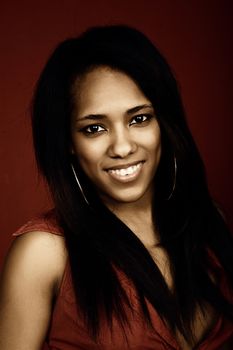 young beautiful woman closeup portrait, on a red background