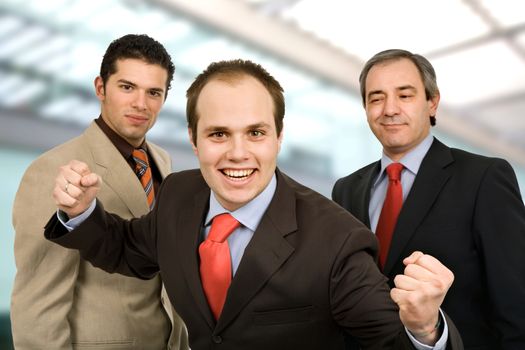 three happy business men at the office