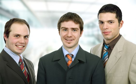 three happy business men together as a team