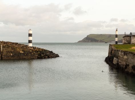 Entrance from the shelter behind the solid sea wall at Carnlough Harbor in Northern Ireland