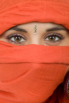 young woman with a veil, close up portrait, studio picture