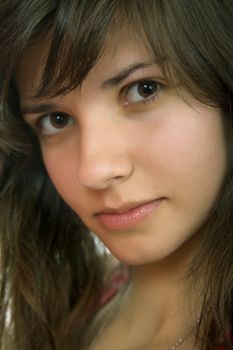 young beautiful pensive woman close up portrait