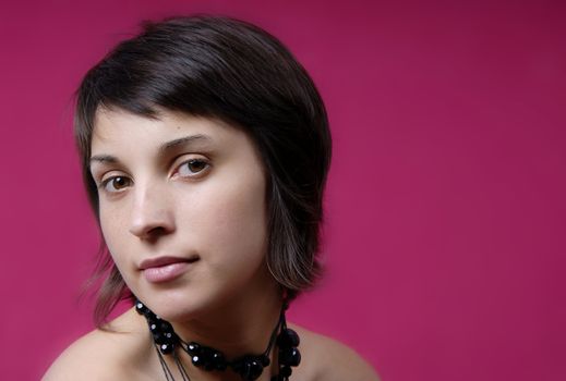 young woman portrait on purple background